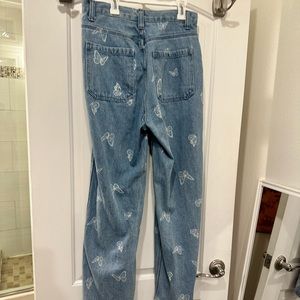 Straight leg (I think) jeans with butterflies